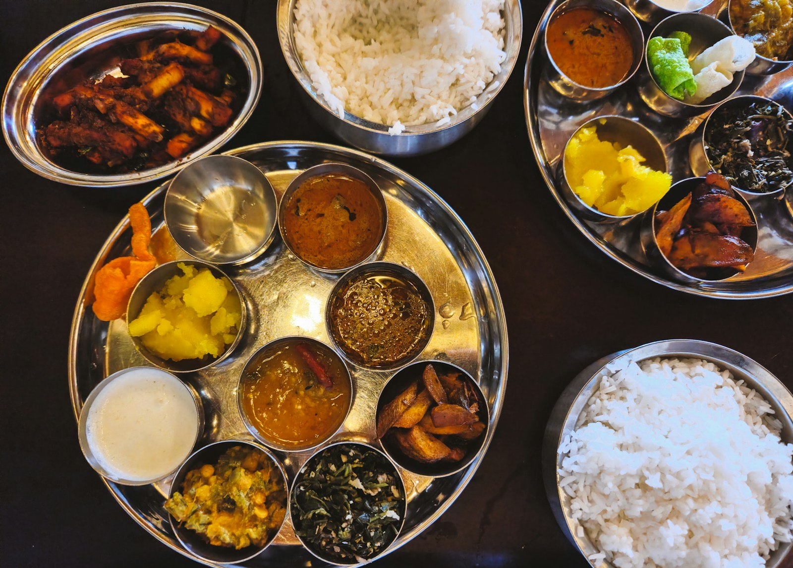 An Indian thali with rice, dal and vegetable side dishes